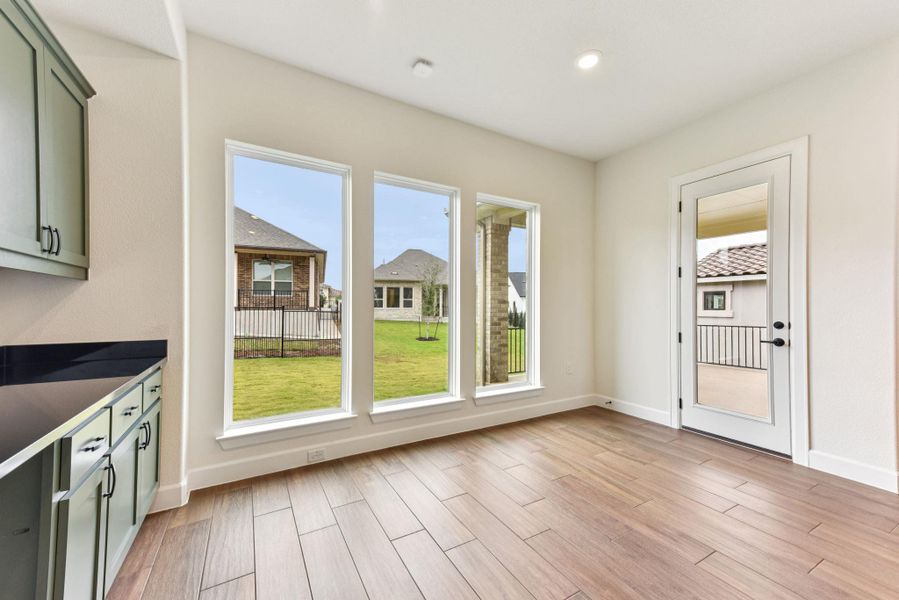 Entryway featuring wood finished floors and recessed lighting