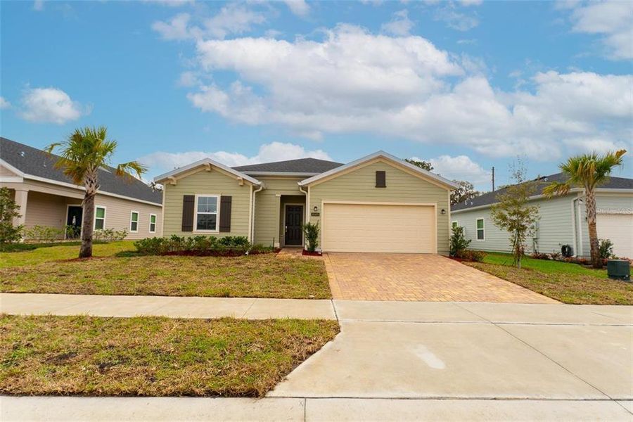 Front exterior of a new home in , Ocala, FL, highlighting curb appeal (Image 1). Front exterior of a new home in , Ocala, FL, highlighting curb appeal (Image 1).