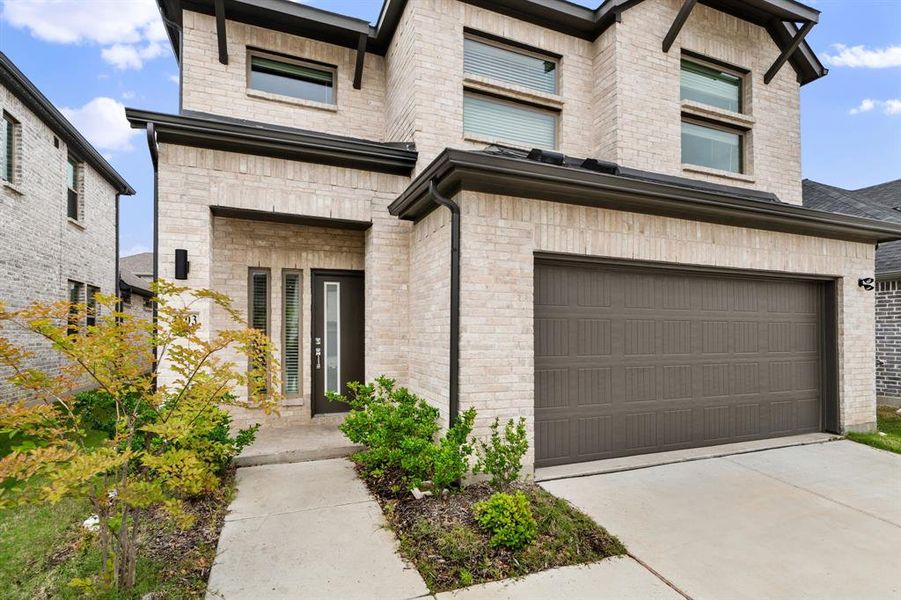 Front exterior of a new home in Eastridge, McKinney, TX, highlighting curb appeal (Image 20). Front exterior of a new home in Eastridge, McKinney, TX, highlighting curb appeal (Image 20).