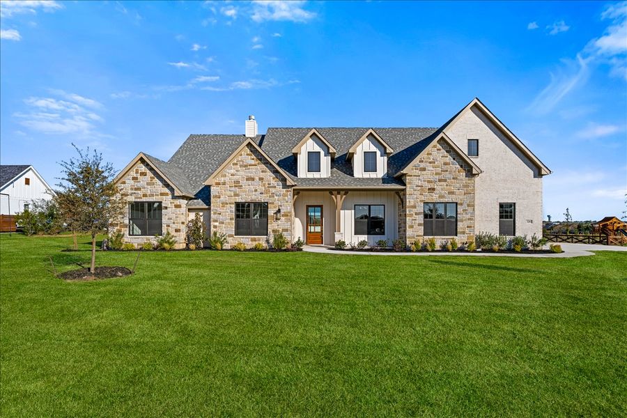 Front exterior of a new home in Stardust Ranch, Northlake, TX, highlighting curb appeal (Image 2). Front exterior of a new home in Stardust Ranch, Northlake, TX, highlighting curb appeal (Image 2).