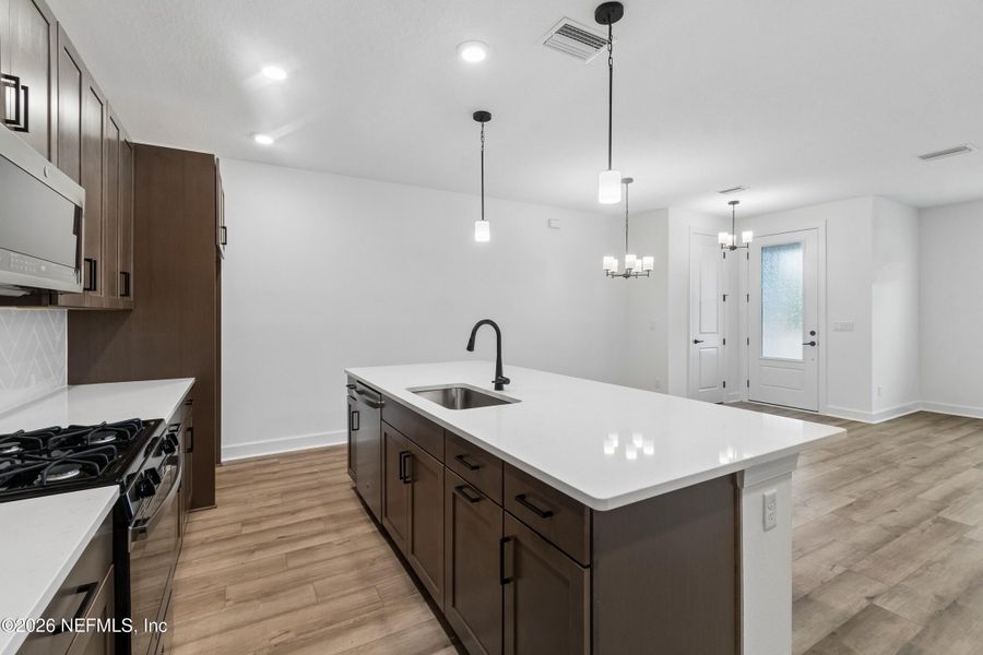 Furnished interior view inside a new home in Westerly Park at Wildlight - Courtyard Collection, Yulee (Image 8).