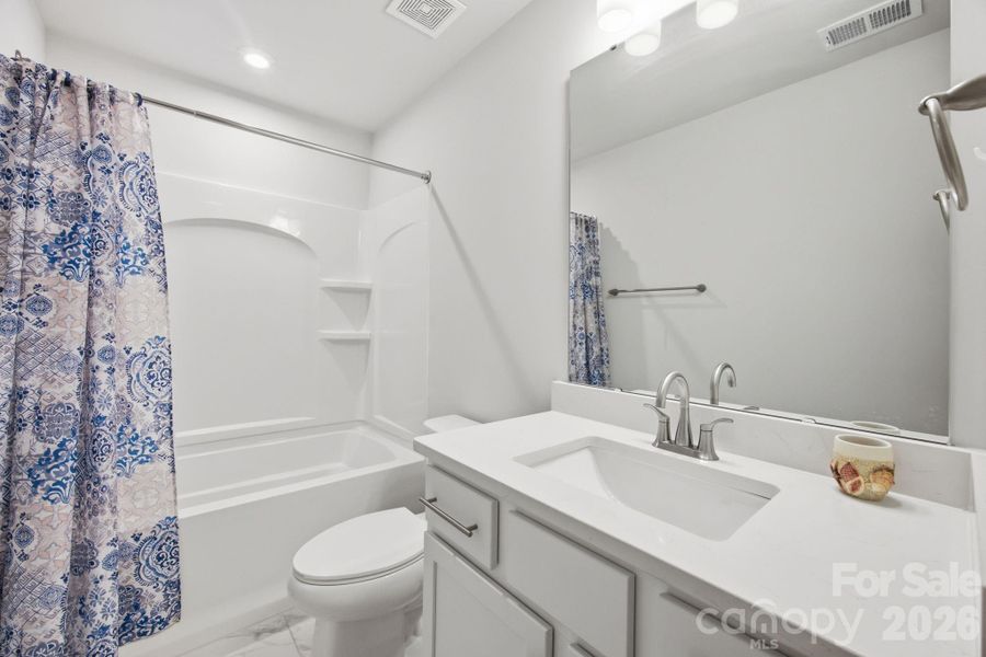 1 of 2 upstairs secondary full baths