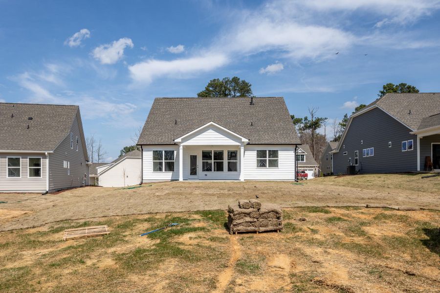 Exterior details and patio area of a home in The Enclave at Hidden Lake - 55+ Community, Youngsville (Image 4).