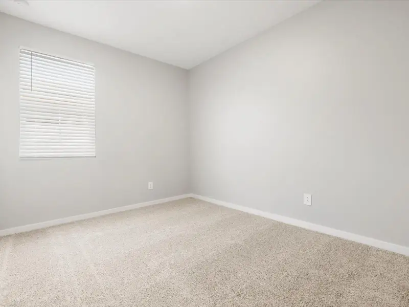 Spacious, unfurnished interior of a new home in Blossom Rock Reserve Series, Apache Junction (Image 14).
