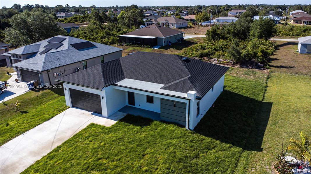 Front exterior of a new home in , Lehigh Acres, FL, highlighting curb appeal (Image 25).