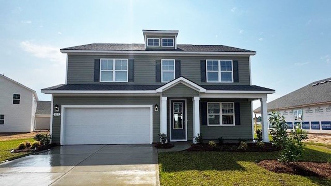 Front exterior of a new home in The Forest at Black Bear, Loris, SC, highlighting curb appeal (Image 1).