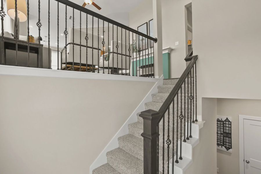 Representative furnished interior of a home built from the Summerhouse 2 by Chesmar Homes in Meridiana Townhomes, Iowa Colony (Image 4).