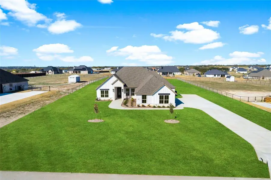 Front exterior of a new home in , Weatherford, TX, highlighting curb appeal (Image 2). Front exterior of a new home in , Weatherford, TX, highlighting curb appeal (Image 2).