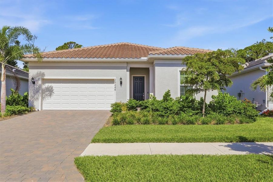 Front exterior of a new home in , Englewood, FL, highlighting curb appeal (Image 22). Front exterior of a new home in , Englewood, FL, highlighting curb appeal (Image 22).