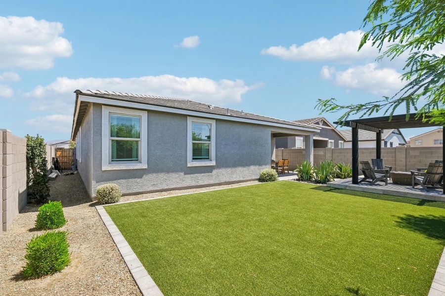 Back exterior elevation with full backyard landscaping Back exterior elevation with full backyard landscaping