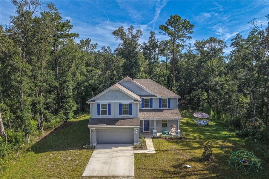 Front exterior of a new home in Flagler Estates, Hastings, FL, highlighting curb appeal (Image 26).