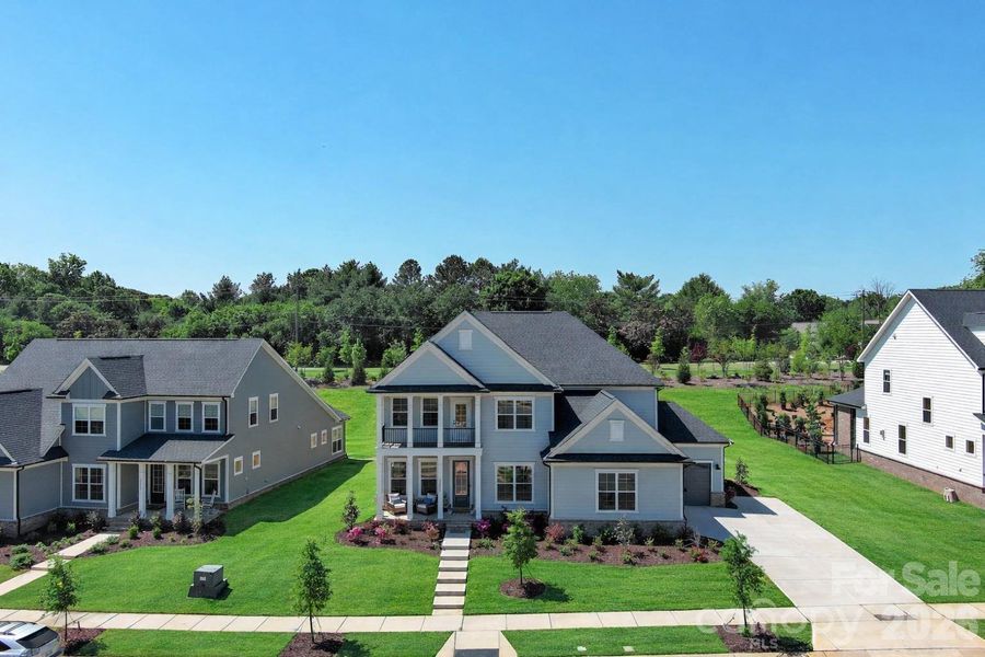 Front exterior of a new home in , Huntersville, NC, highlighting curb appeal (Image 1). Front exterior of a new home in , Huntersville, NC, highlighting curb appeal (Image 1).