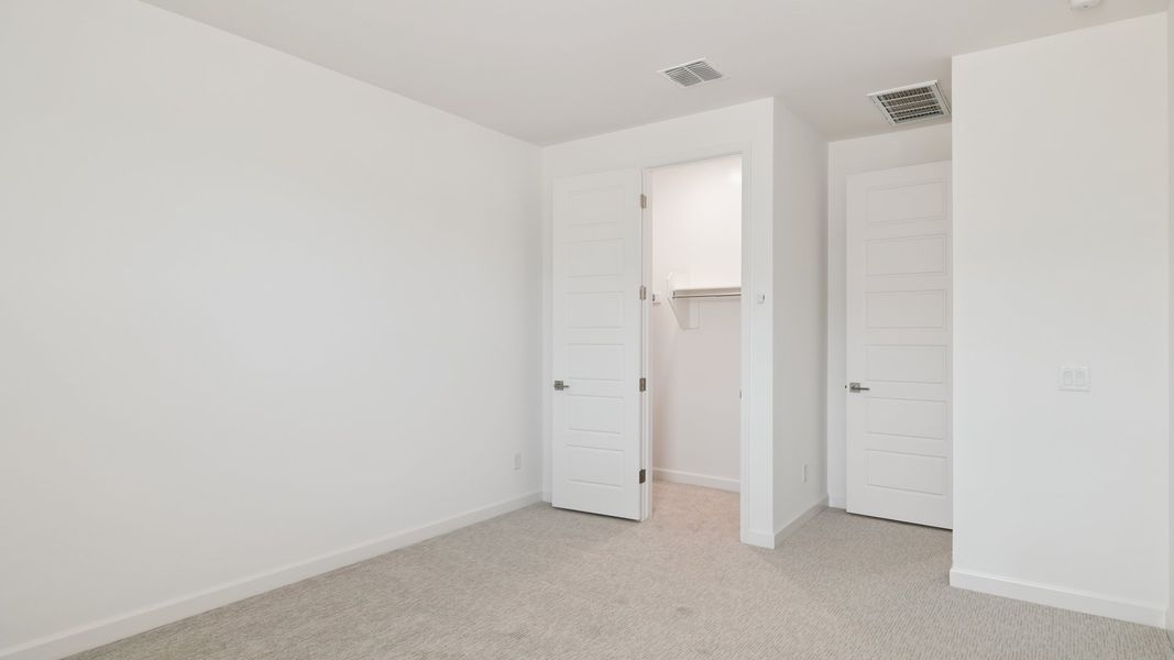 Spacious, unfurnished interior of a new home in Zanjero Pass, Waddell (Image 39).