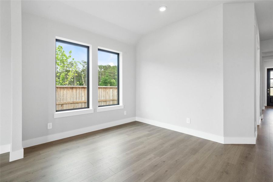 This dining area is a natural extension of the kitchen and living room, allowing for seamless conversation and connection with guests or family members, even when preparing a meal.