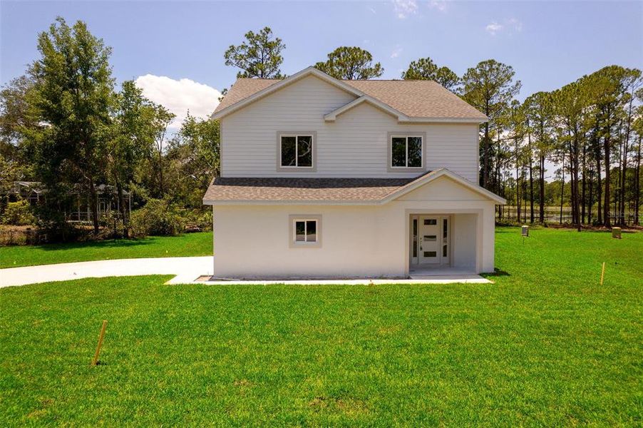Front exterior of a new home in , Deltona, FL, highlighting curb appeal (Image 30).