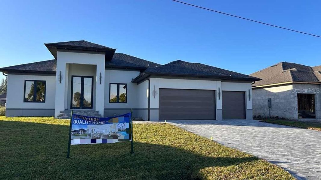 Front exterior of a new home in , Port Charlotte, FL, highlighting curb appeal (Image 1). Front exterior of a new home in , Port Charlotte, FL, highlighting curb appeal (Image 1).