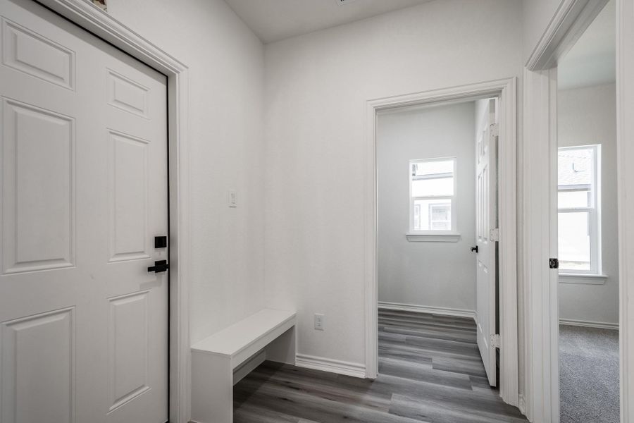 Hallway to garage and laundry room.
