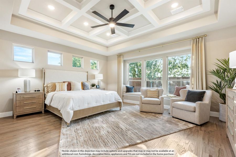 Master bedroom with coffered ceiling, ceiling fan, hardwood floors, and large windows with seating area Master bedroom with coffered ceiling, ceiling fan, hardwood floors, and large windows with seating area