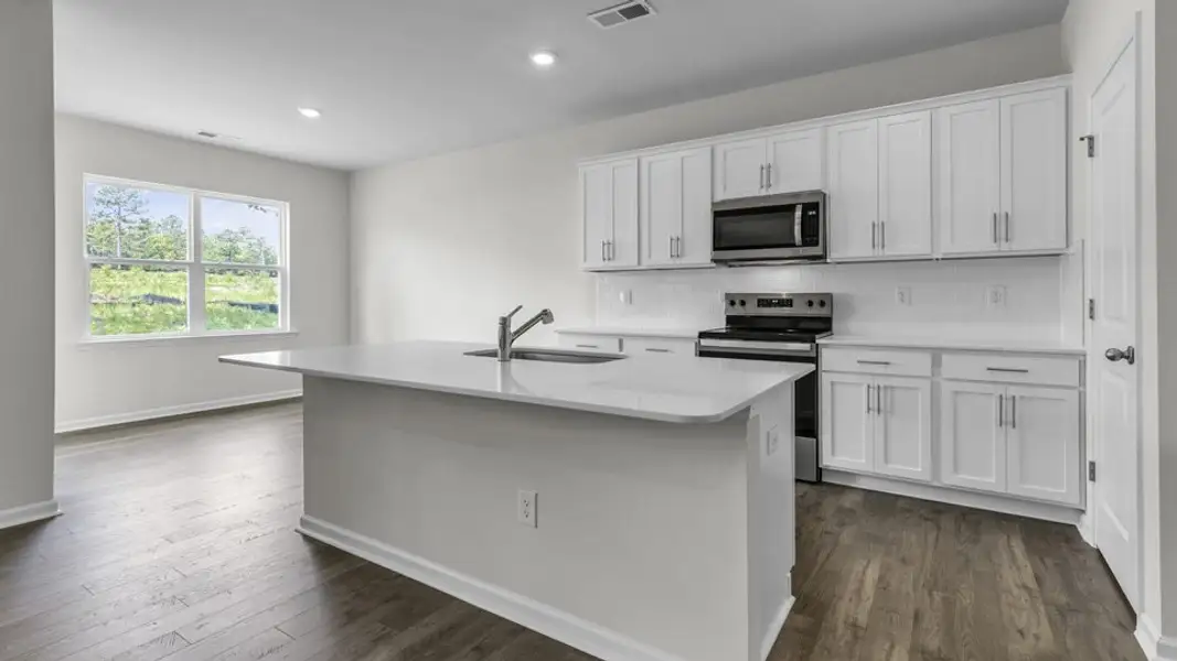 Furnished interior view inside a new home in Villa Grande, Winterville (Image 4).