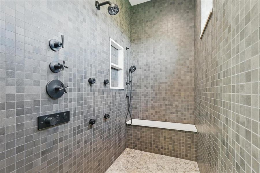 Bathroom featuring a tile shower Bathroom featuring a tile shower
