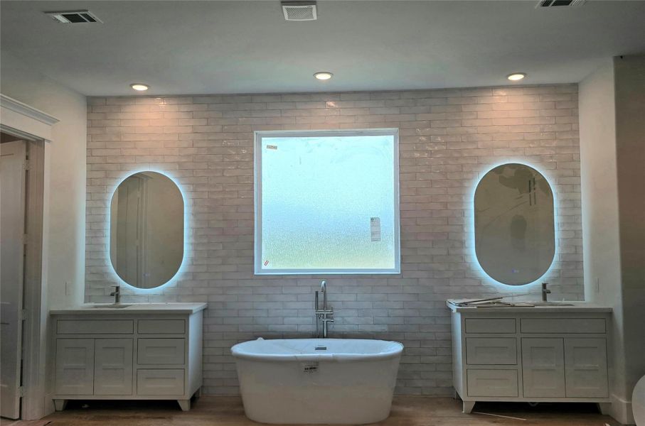 Primary vanity and tub area, must be seen to appreciate the size of this bathroom Primary vanity and tub area, must be seen to appreciate the size of this bathroom
