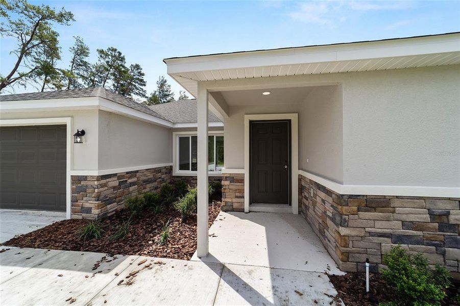 Front exterior of a new home in , Silver Springs, FL, highlighting curb appeal (Image 21).