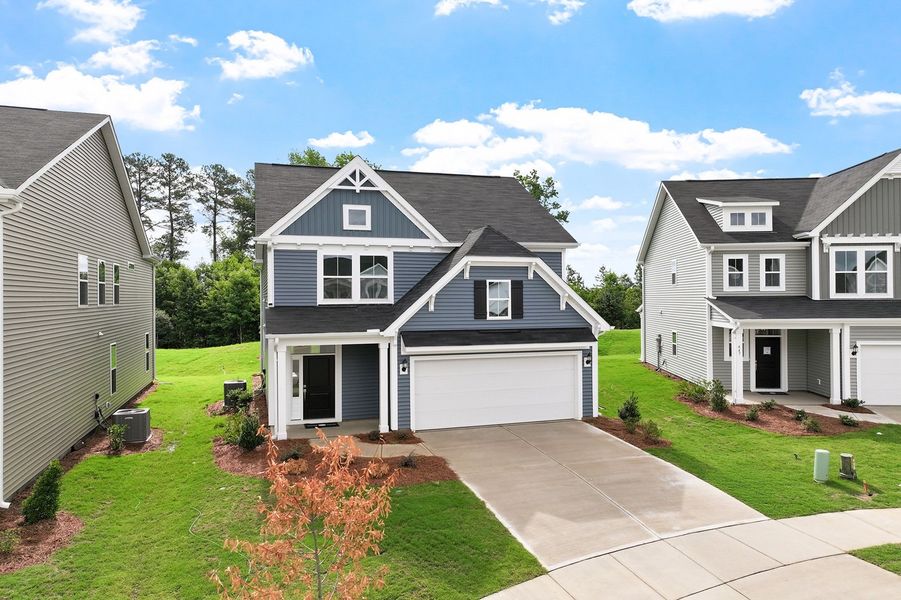 Front exterior of a new home in Renaissance at White Oak, Garner, NC, highlighting curb appeal (Image 2). Front exterior of a new home in Renaissance at White Oak, Garner, NC, highlighting curb appeal (Image 2).