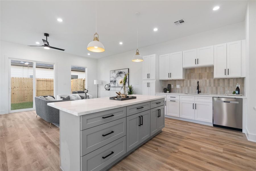 The home follows a light, airy theme, blending soft colors with earth tones for a welcoming and serene atmosphere. This palette enhances the sense of spaciousness while creating a cozy, inviting feel throughout. It’s a design that’s both timeless and effortlessly comforting.