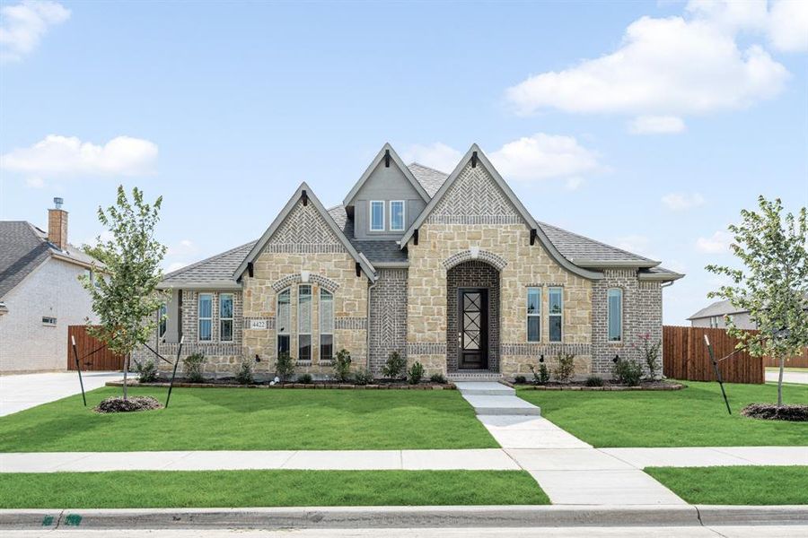 Front exterior of a new home in Ridgepoint, Midlothian, TX, highlighting curb appeal (Image 2).