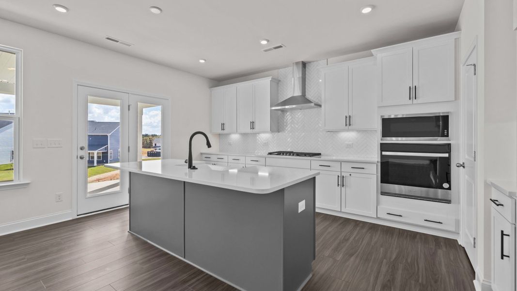 Gourmet Kitchen option with wall oven/microwave and vented hood, in the Burton Design by DRB Homes in Mooresville, NC