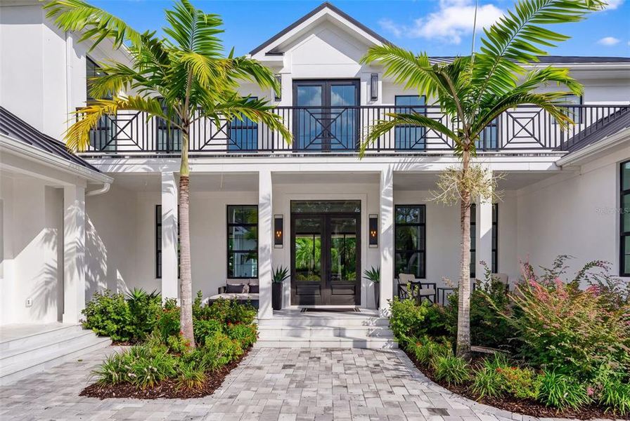 Front exterior of a new home in , Sarasota, FL, highlighting curb appeal (Image 26). Front exterior of a new home in , Sarasota, FL, highlighting curb appeal (Image 26).