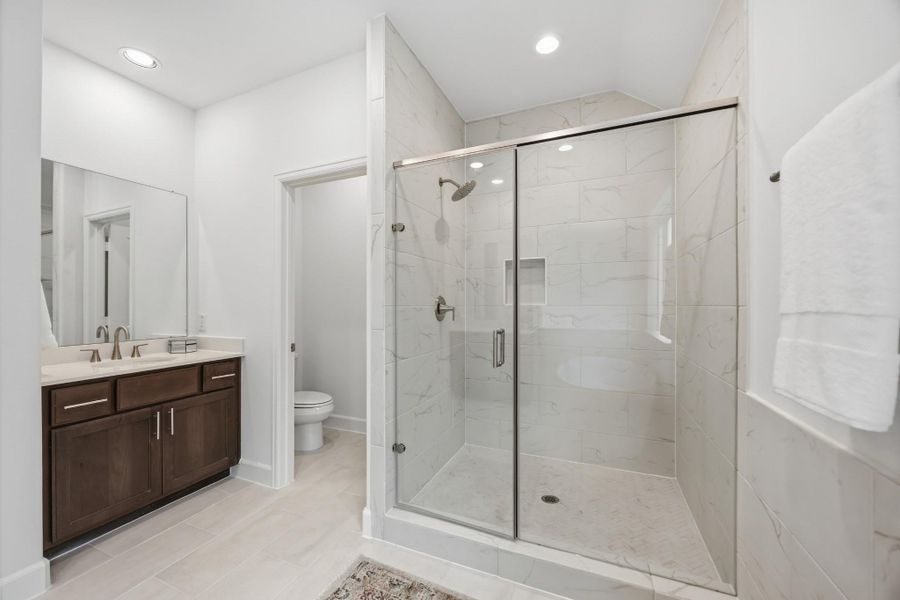 Shower in Style: Revel in the expansiveness of a large shower, standard with sleek finishes and a built-in niche, keeping essentials elegantly within reach.