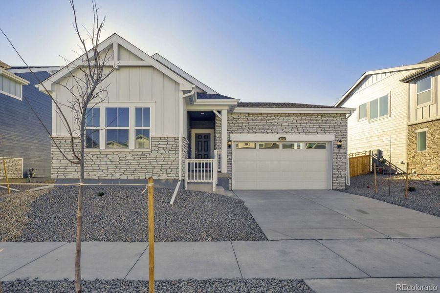 Front exterior of a new home in Ledge Rock, Johnstown, CO, highlighting curb appeal (Image 1). Front exterior of a new home in Ledge Rock, Johnstown, CO, highlighting curb appeal (Image 1).