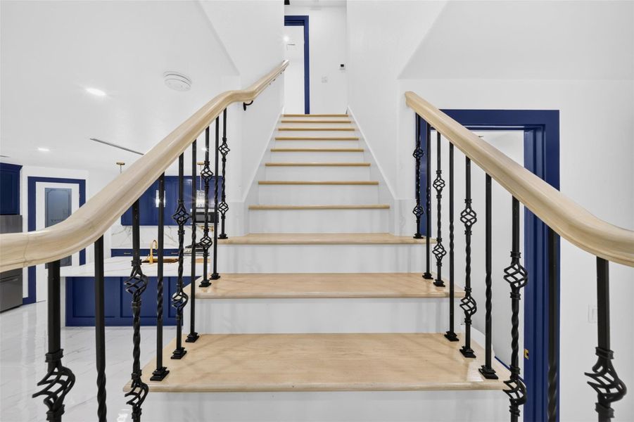 Grand staircase creates an impressive focal point and architectural feature