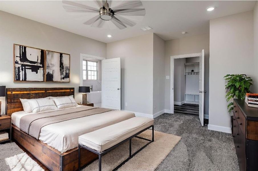 Carpeted bedroom featuring a ceiling fan and recessed lighting