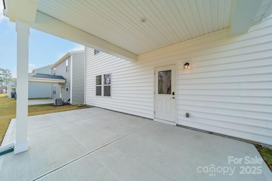 Exterior details and patio area of a home in Stewarts Landing, Charlotte (Image 25).