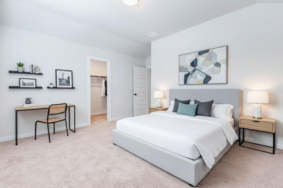 This view highlights the walk-in closet off one of the upstairs bedrooms, providing great storage and organization potential. With plenty of hanging space and shelving, it’s both practical and spacious. This photo has been virtually staged for visual reference.