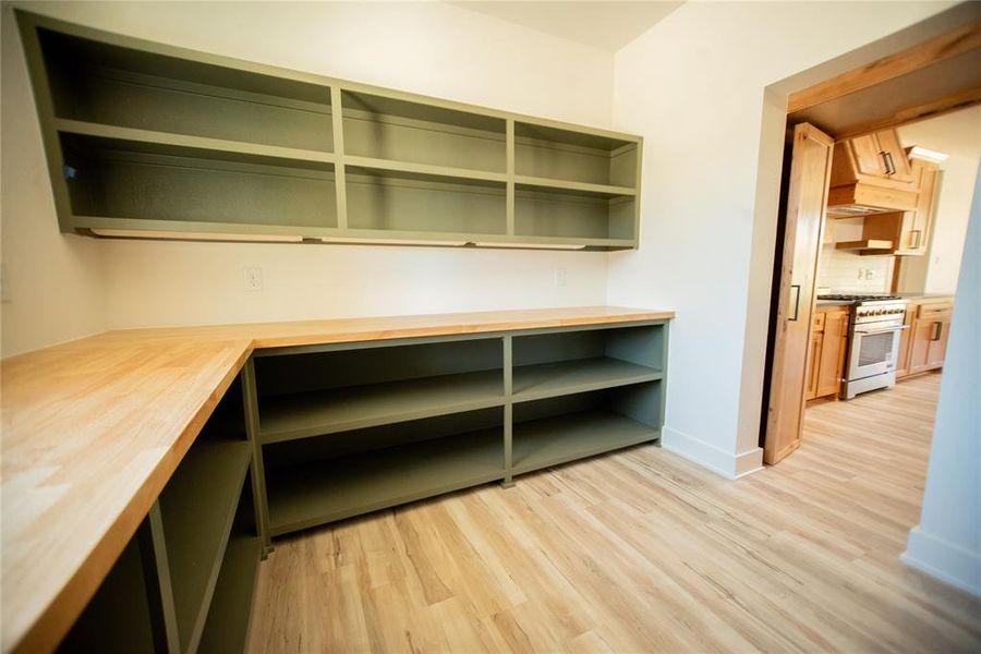 Unfurnished office with baseboards and light wood finished floors Unfurnished office with baseboards and light wood finished floors