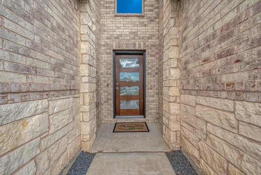 Exterior details and patio area of a home in Grand Magnolia, Magnolia (Image 4).
