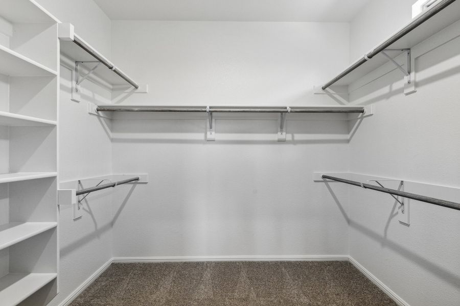Primary closet in the Sapphire home plan by Trophy Signature Homes – REPRESENTATIVE PHOTO Primary closet in the Sapphire home plan by Trophy Signature Homes – REPRESENTATIVE PHOTO