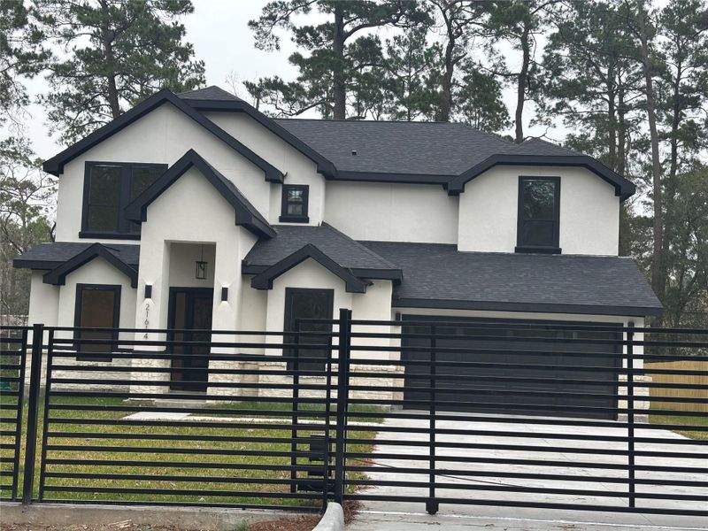 Front exterior of a new home in , Humble, TX, highlighting curb appeal (Image 2).