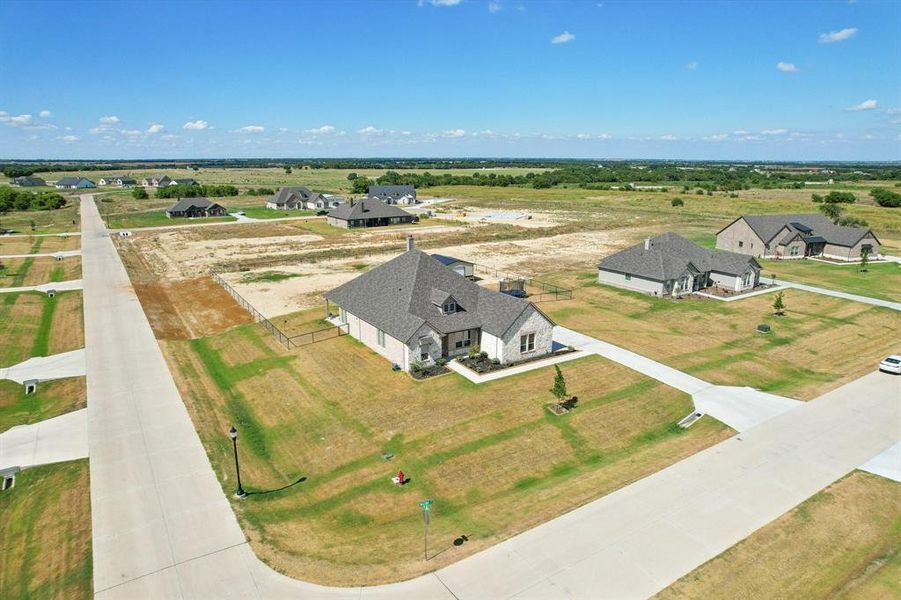Aerial perspective of the 1-acre corner lot.
