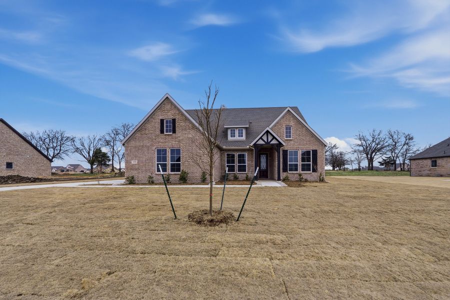 Front exterior of a new home in Fannin Ranch, Leonard, TX, highlighting curb appeal (Image 23). Front exterior of a new home in Fannin Ranch, Leonard, TX, highlighting curb appeal (Image 23).