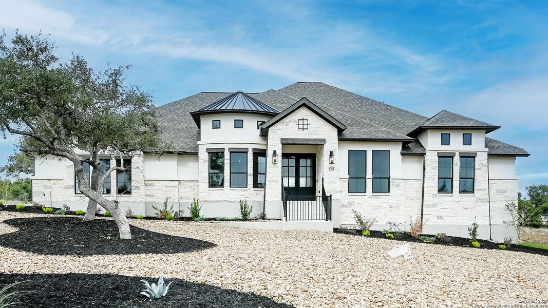 Front exterior of a new home in The Preserve At Elm Creek 1 Acre, Canyon Lake, TX, highlighting curb appeal (Image 2). Front exterior of a new home in The Preserve At Elm Creek 1 Acre, Canyon Lake, TX, highlighting curb appeal (Image 2).