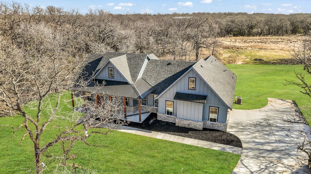 Representative exterior photo of a completed home built from the Clementine by Zeal Home Builders in Saddle Crest Estates, Weatherford, TX (Image 30).