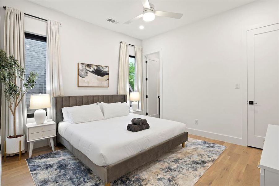 Light wood-finish flooring with a modern area rug