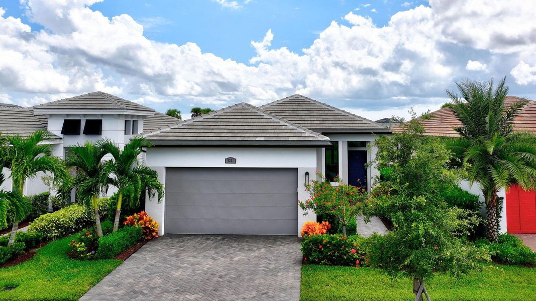 Front exterior of a new home in , Port St. Lucie, FL, highlighting curb appeal (Image 24).