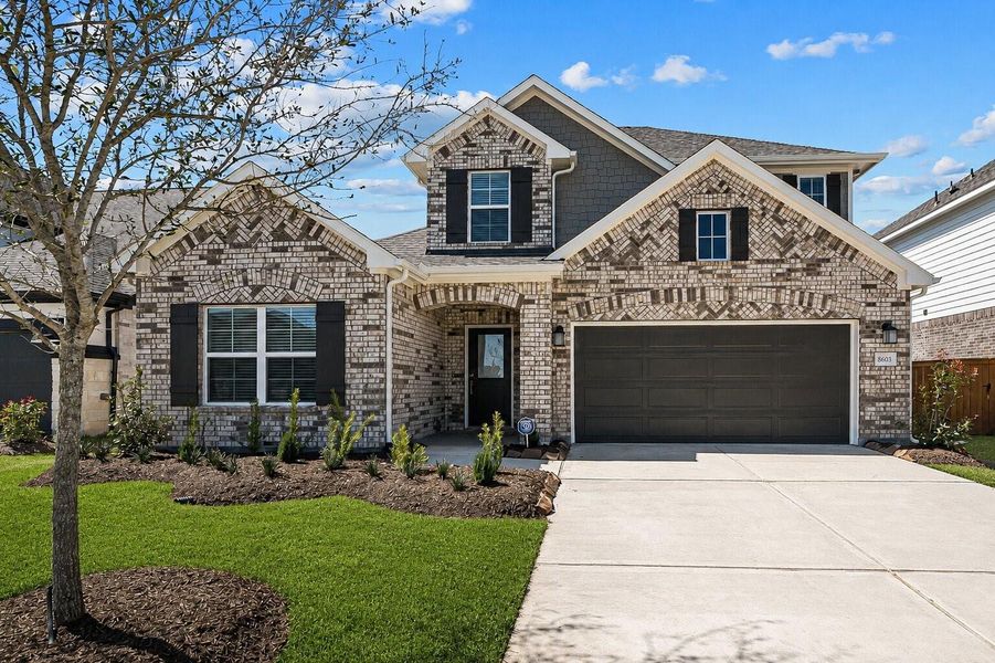 Front exterior of a new home in Marvida, Cypress, TX, highlighting curb appeal (Image 1). Front exterior of a new home in Marvida, Cypress, TX, highlighting curb appeal (Image 1).