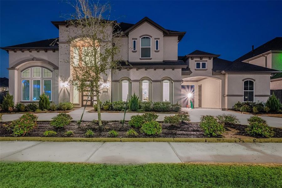 Welcome to this stunning Coventry Home, featuring the Roxton Plan, situated on a huge corner lot in the prestigious 75 ft section of Harvest Green. With stucco elevation and a curved driveway, this home boasts unmatched curb appeal, inviting you through its impressive double-door entry.