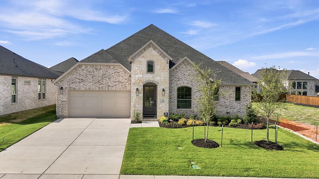 Front exterior of a new home in The Homestead - 62', Rockwall, TX, highlighting curb appeal (Image 23).